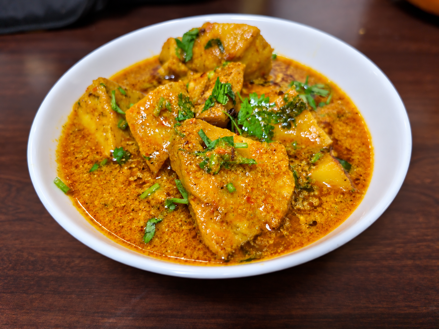 Paneer curry with rich tomato gravy and herbs